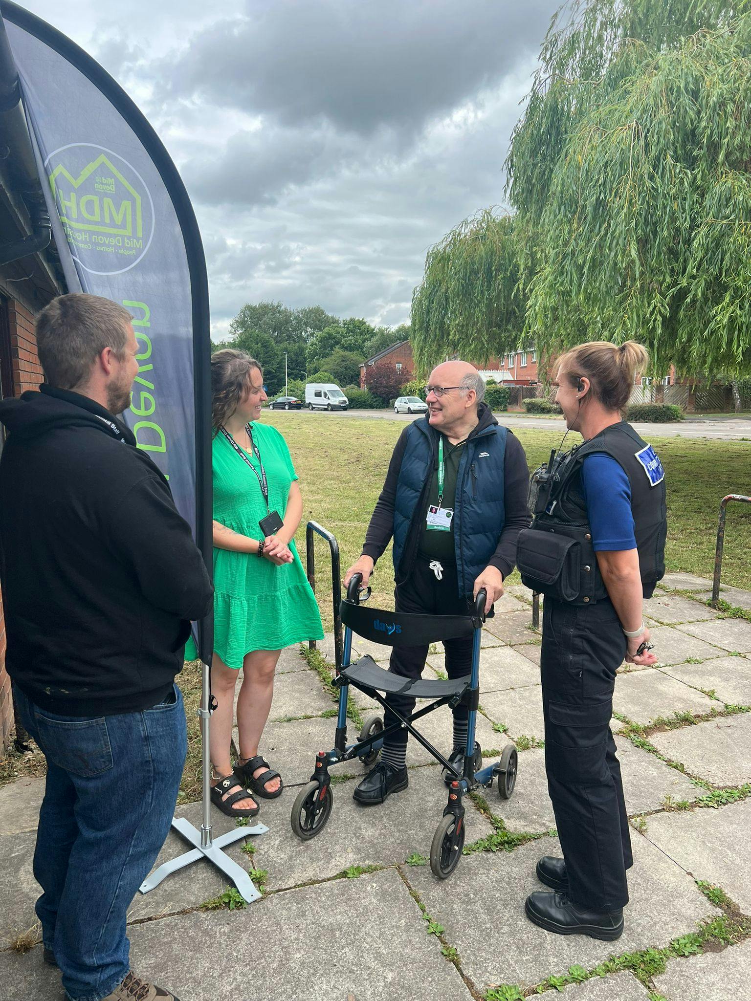 Police and MDH speak with a tenant at a coffee morning