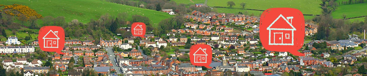 Photo of Newtown in Powys with four red speech bubbles with an icon of a house in each