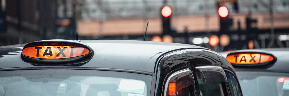 Image shows taxis lined up in traffic.