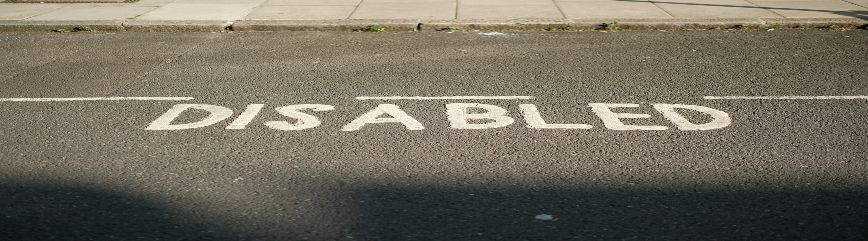 Photo of Disabled Persons Parking Place road markings.