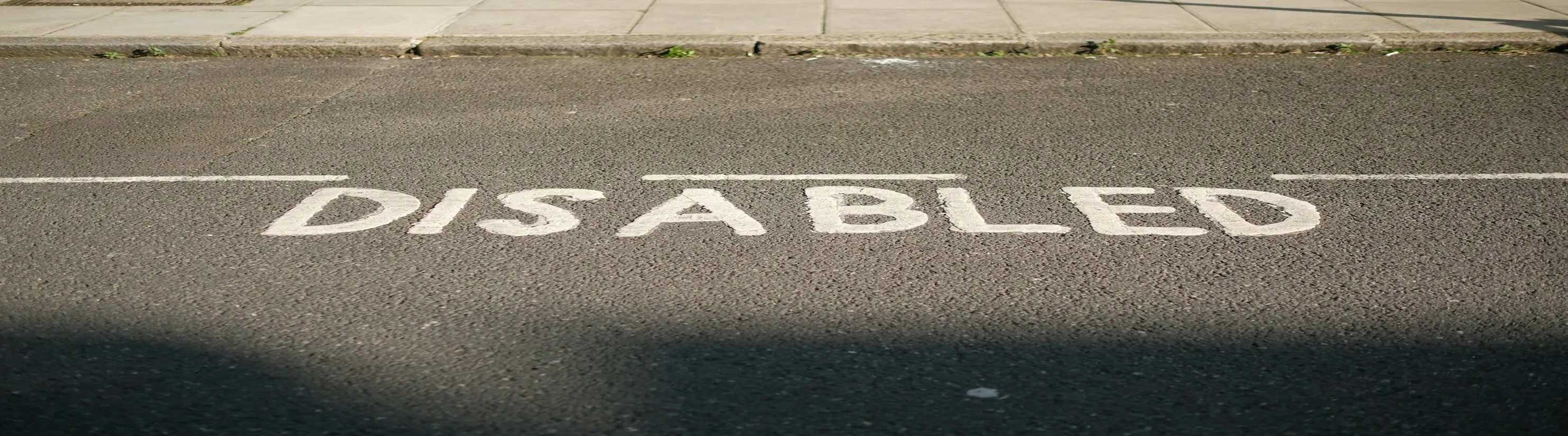 Photo of Disabled Persons Parking Place road markings.