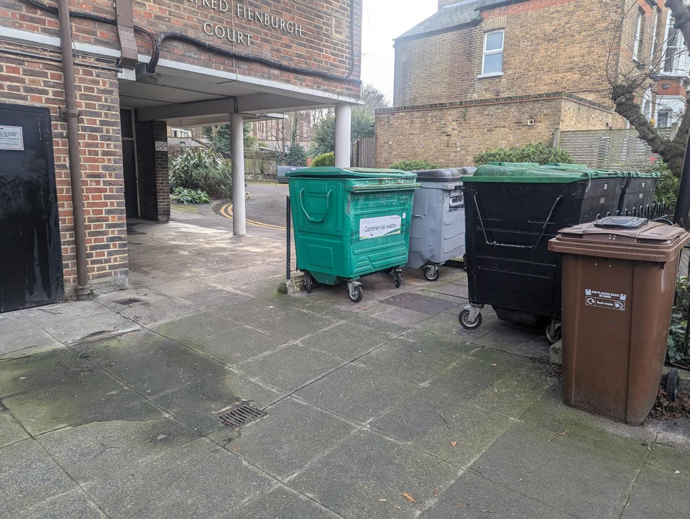 Waste bins in front of main entrance.png
