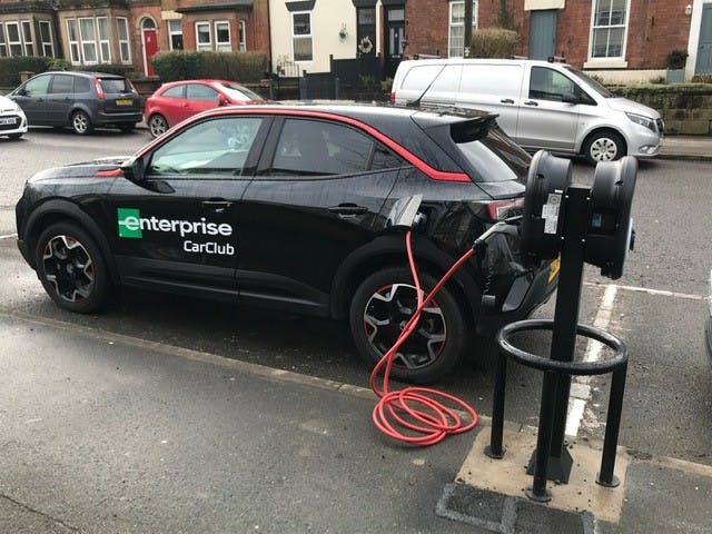 Photograph of a car club electric vehicle being charged