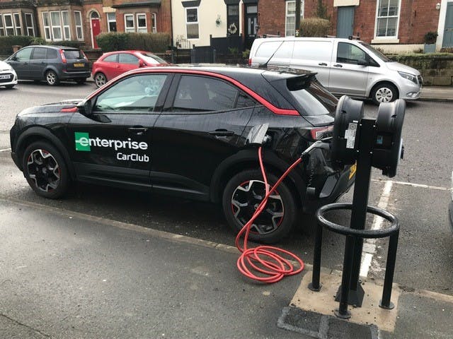 Photograph of a car club electric vehicle being charged
