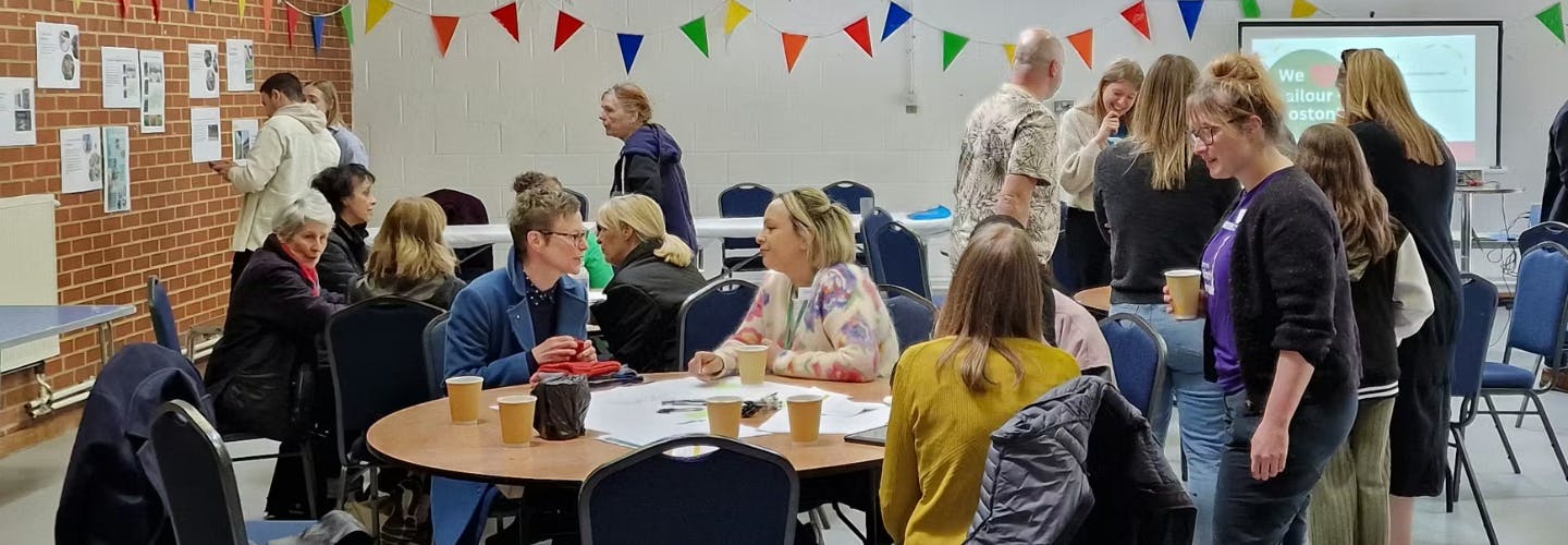 A group of people doing various activities in an indoor community space.