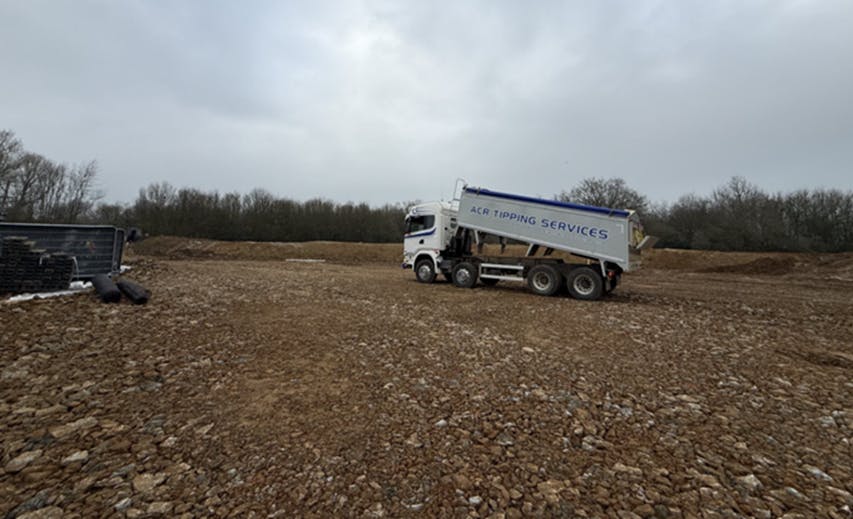 Site preparation Mid March 2026: lorry tipping finer aggregate to build site vehicle tracks out of saturated ground