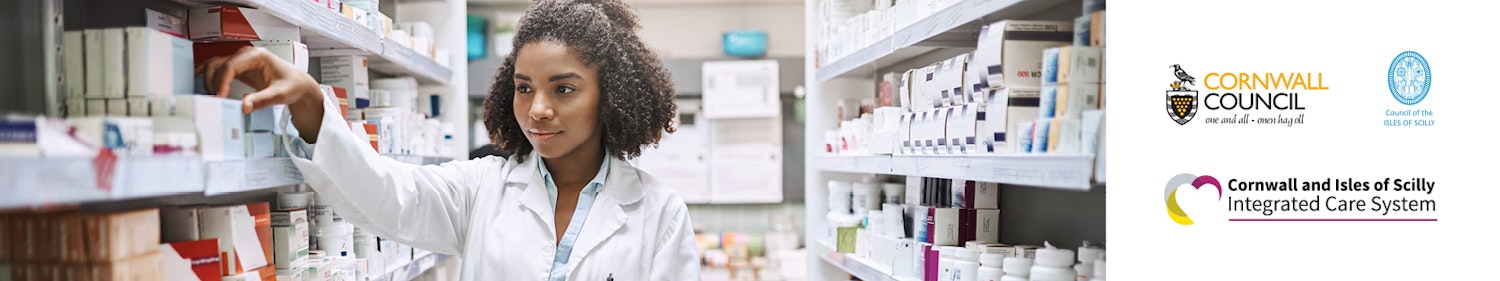 Woman selecting items from a pharmacy shelf