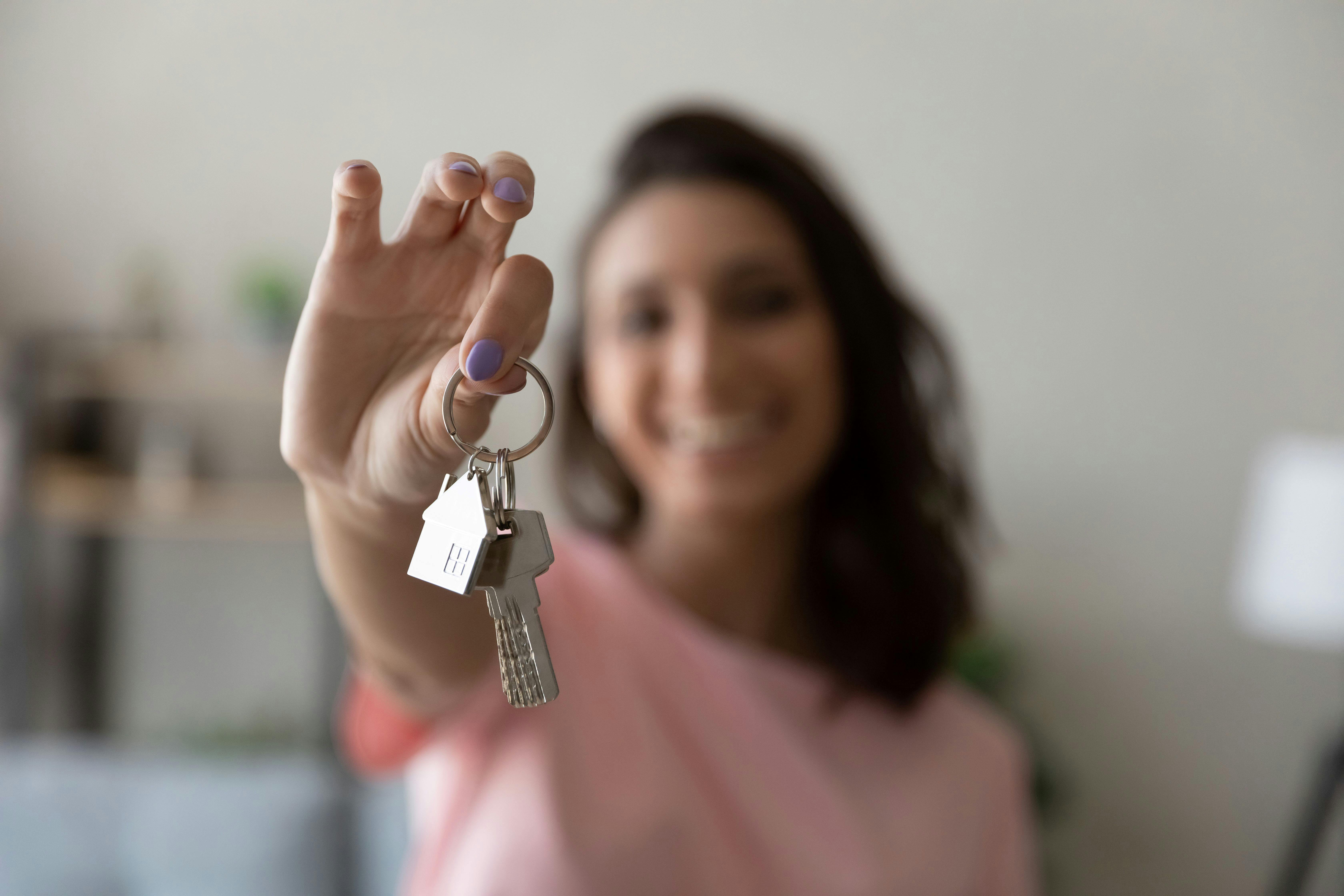 Lady holding door keys