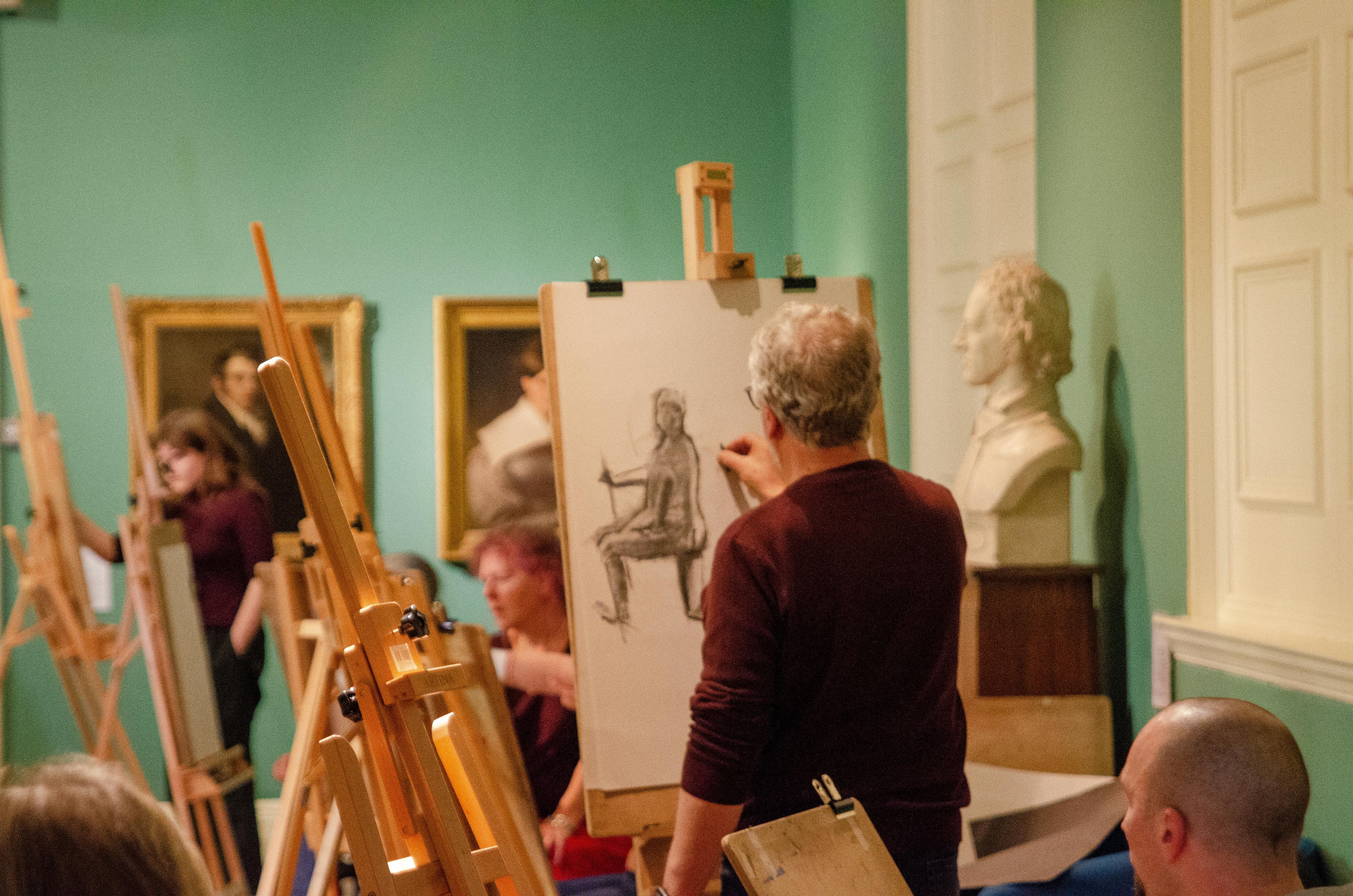 An image of the public completing life drawing in the Usher Gallery