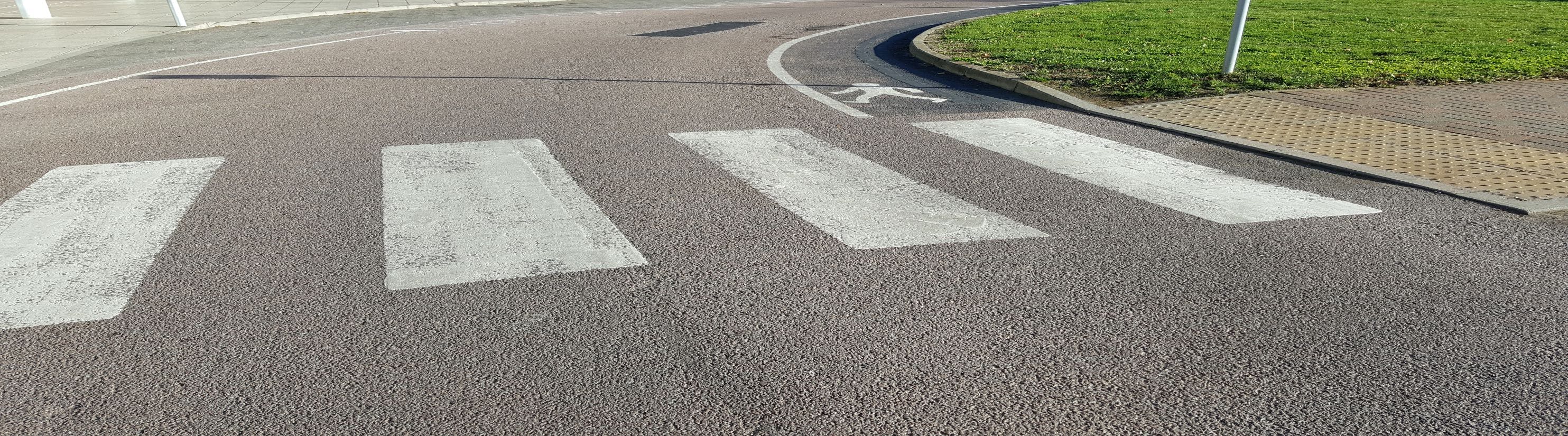 Photo of zebra crossing road markings.