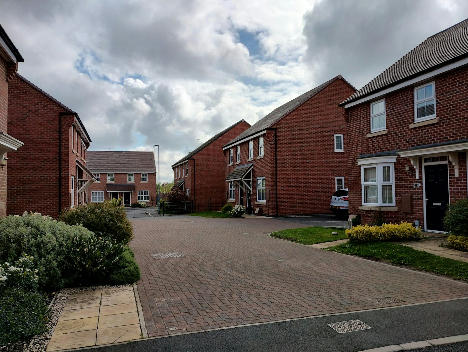Your Voice Bassetlaw with a drawing of a woman in front of a house