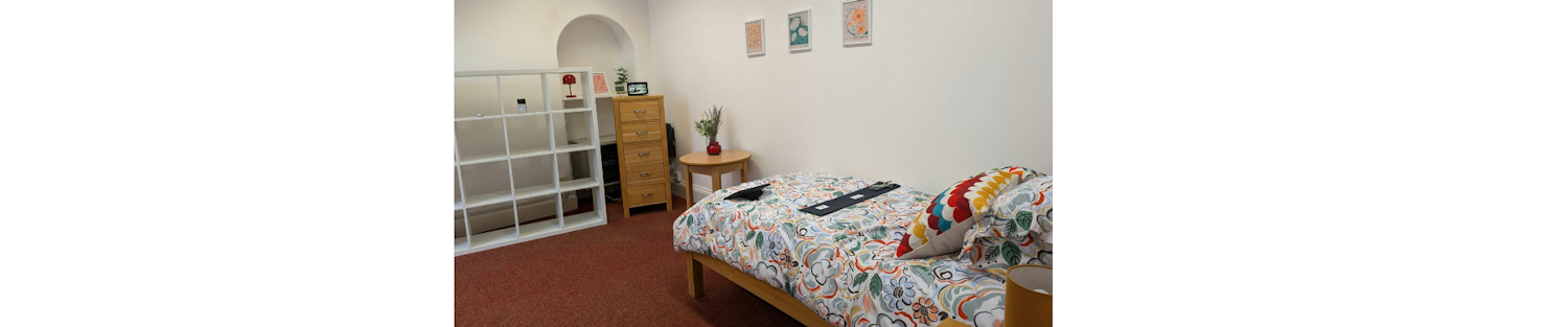 Interior photo of bed and some technology at TEC Room