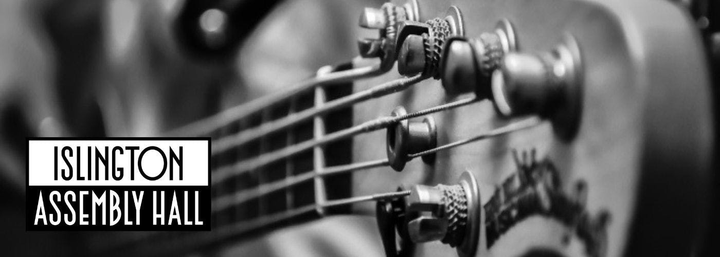 Black and white close up photo of electric bass guitar detail with Islington Assembly Hall logo.