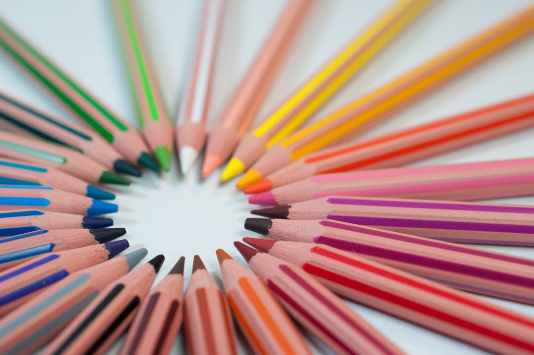 Coloured pencils laid out in a circle