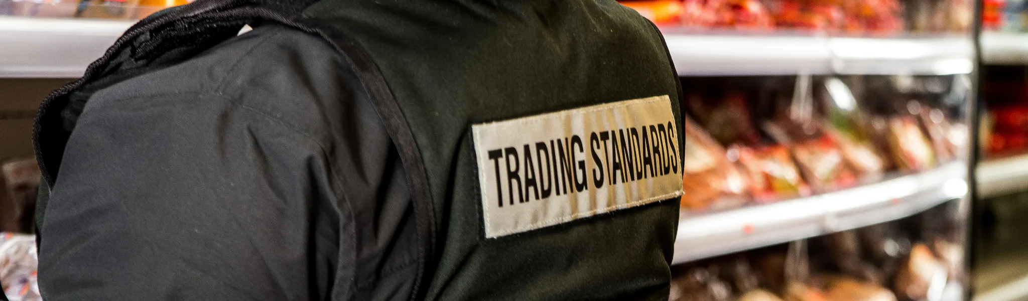 An image of a Trading Standards officer inspecting a shop 