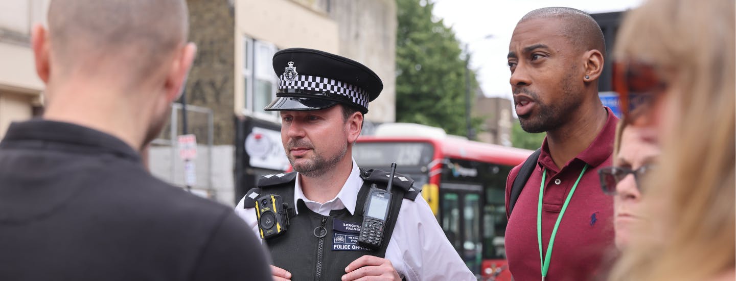 Safer Spaces Banner police officer surrounded by members of different council teams attending an outdoor event