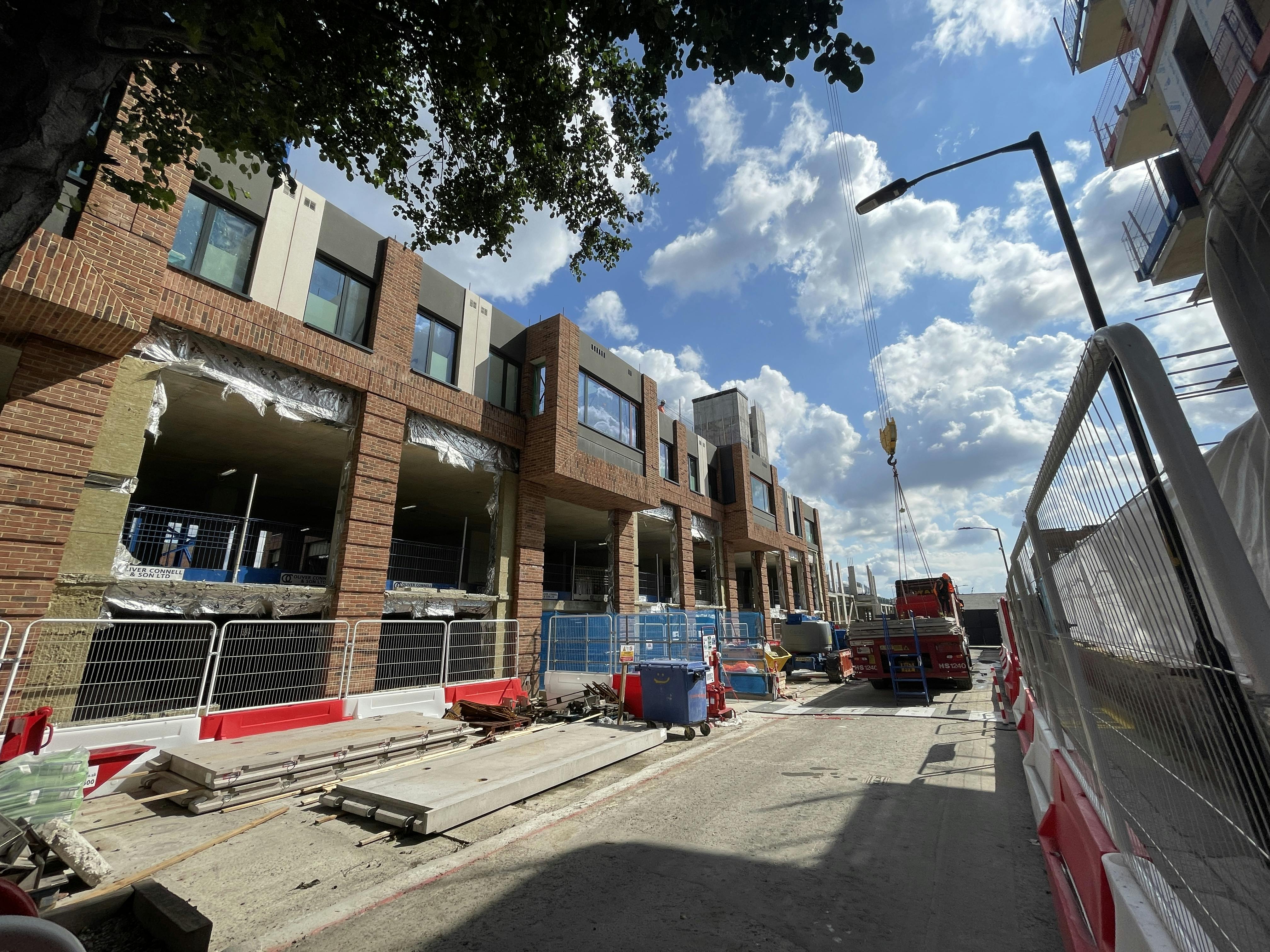 2nd floor slabs being offloaded awaiting installation into position_Jul23