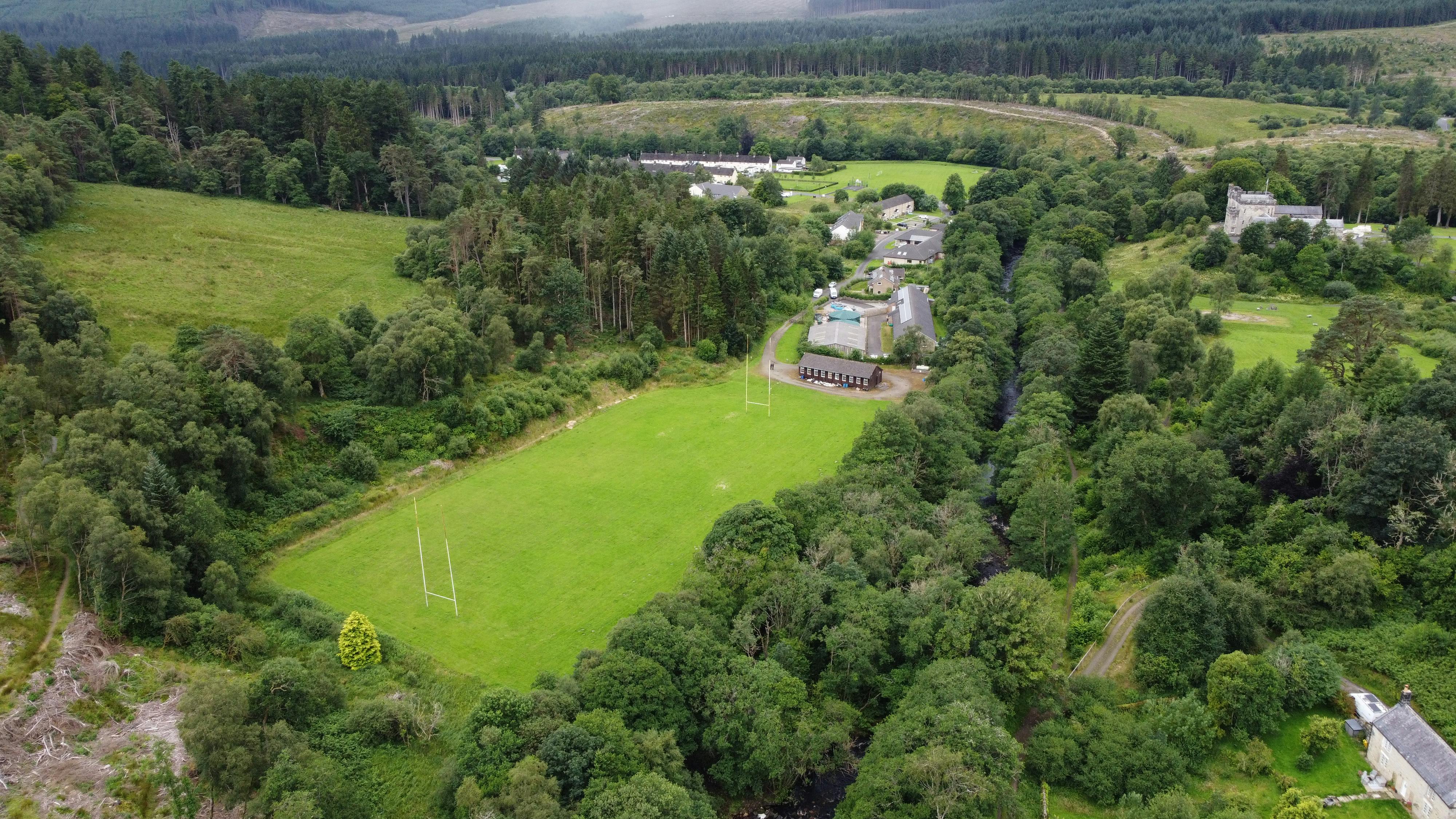 Drone photograph from the Northern extent of the Butteryhaugh FAS, showing the Border Park Rugby Club and the surrounding terrain