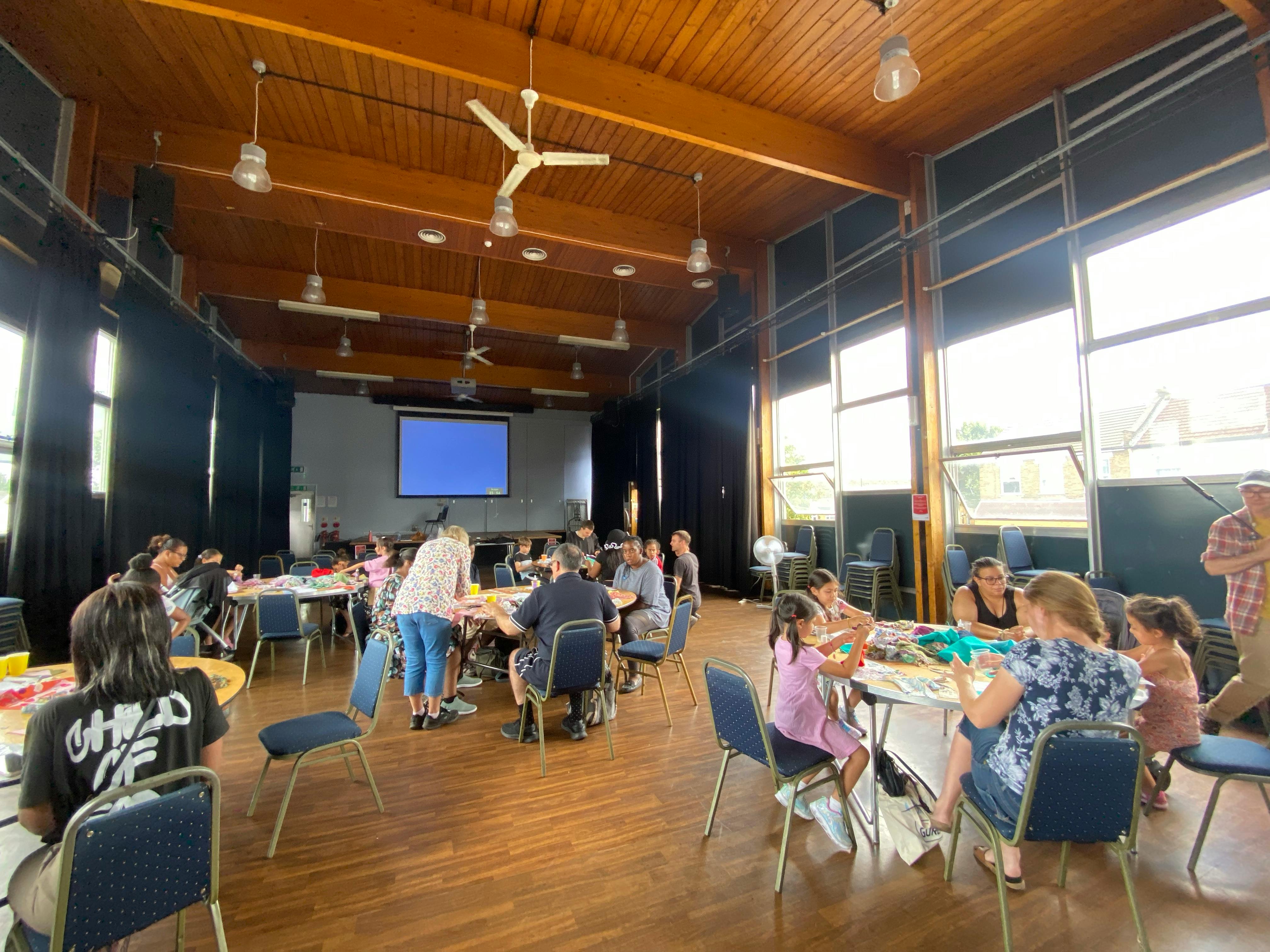 Community members designing the curtains in Angel Community Centre
