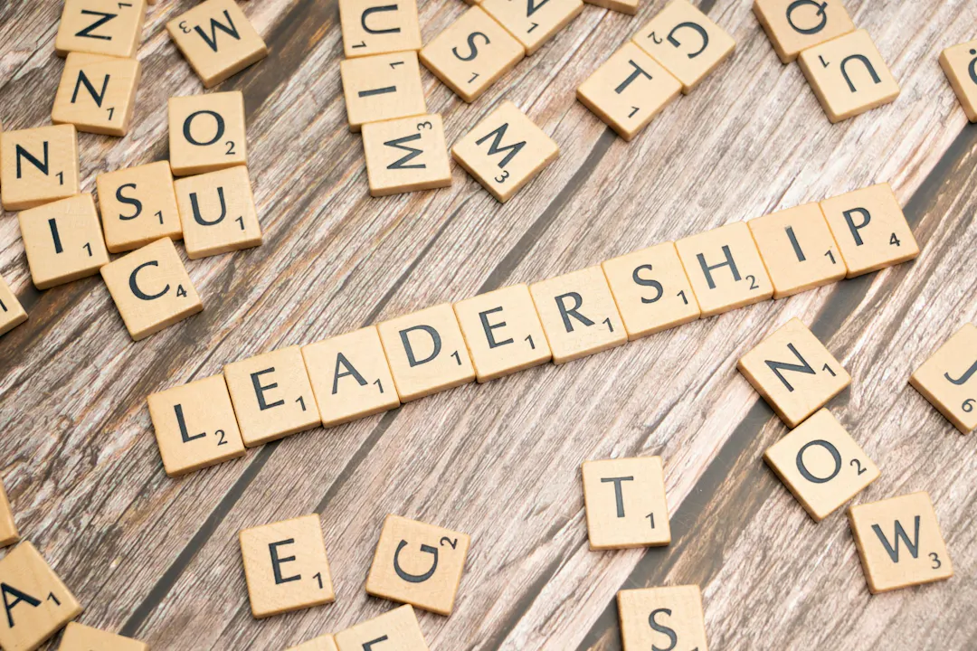 The word leadership is spelt out in wooden scrabble letters